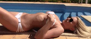 Busty teen blonde at the pool