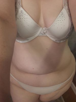Wife showing the bra and panties she is wearing for another guy
