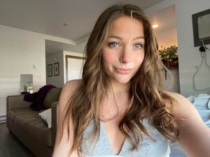 Pretty blonde with cum on her face