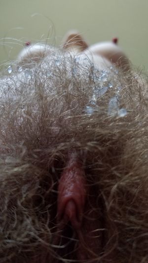 Pink clit with cum in the pussy hair