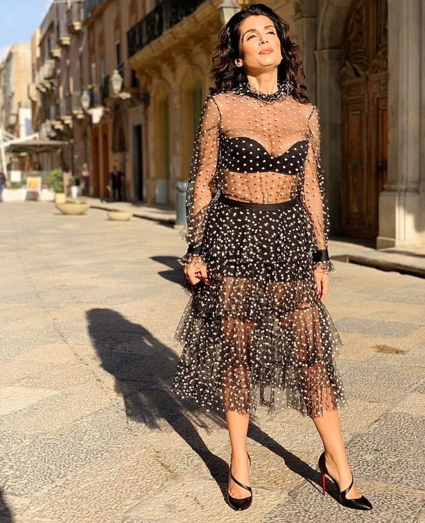 Seductive dark hair babe posing outdoors in retro sheer dress
