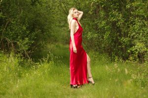 Blonde in shiny red dress