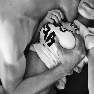 Grabbing her breast and kissing her neck