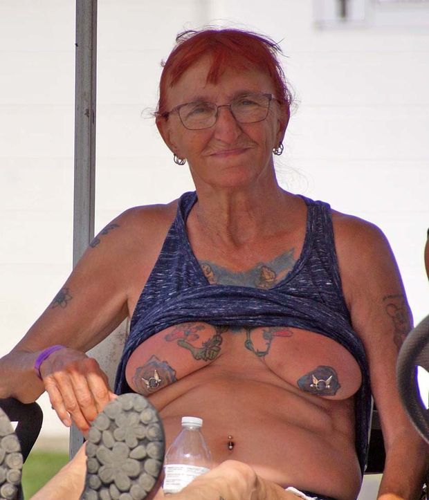 Biker granny has her tits out