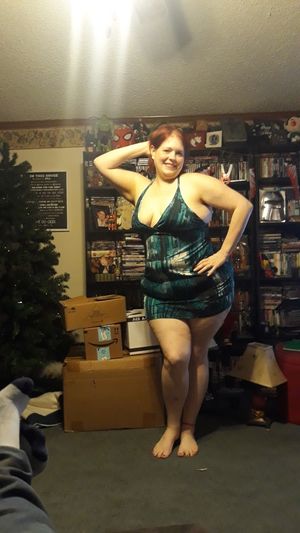 Wife showing off her outfit for her date