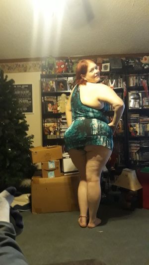 Wife showing off her outfit for her date