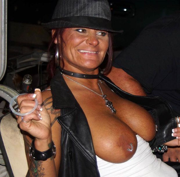 Biker rally lady with nipple piercing