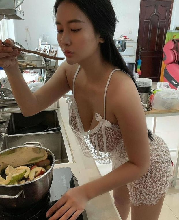 Is she Cooking some Sauce?