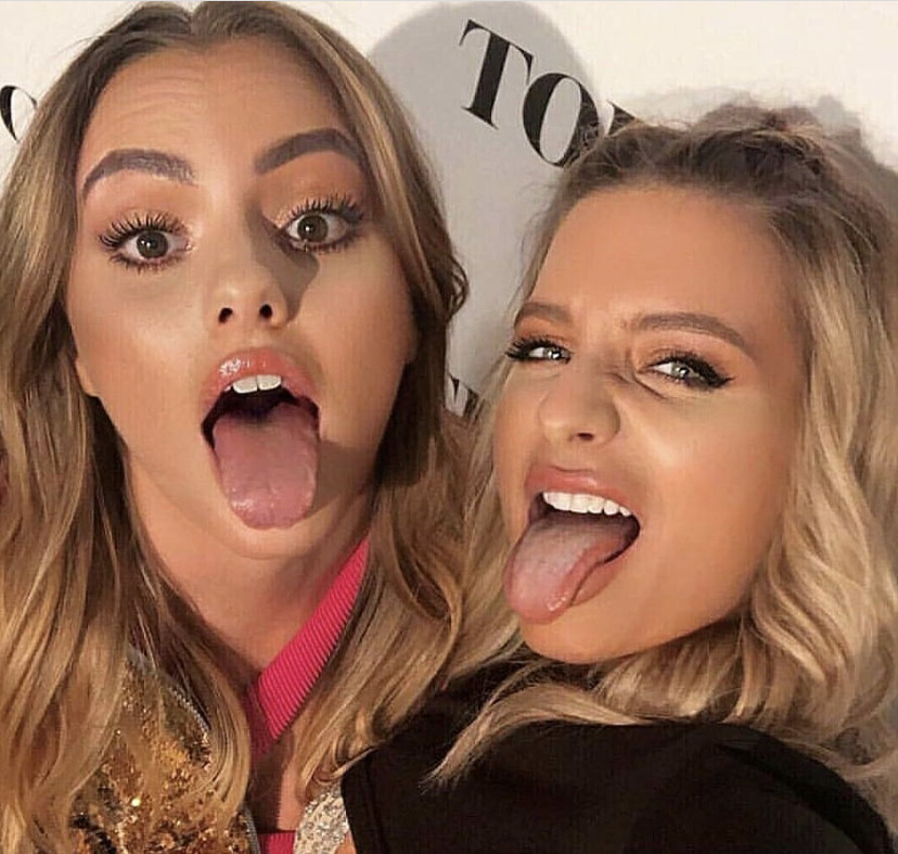 Two babes tongue out