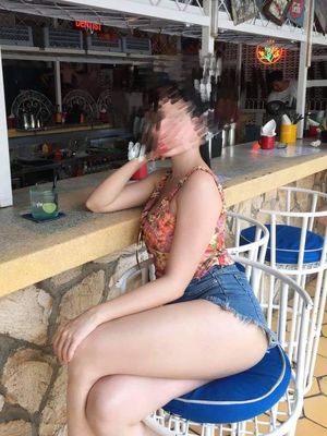 Sexy Asian In Crossed Legs At Restaurant