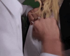 Ripping her shirt open