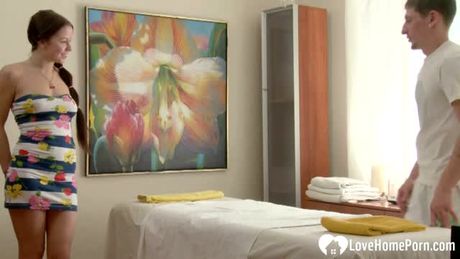 Masseur slides his cock in while working