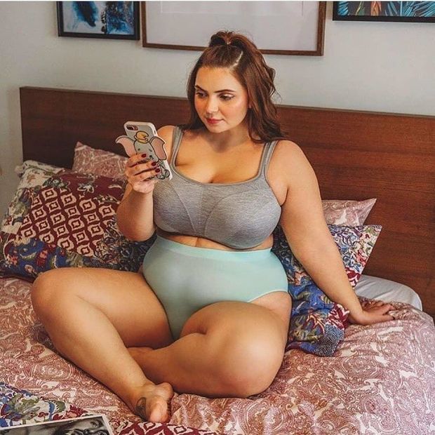 Sitting On the Bed In Her Underwear