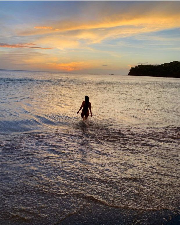 A great sunset with a gorgeous woman with excellent scenery.