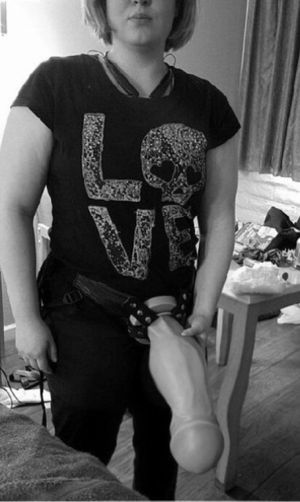 Girlfriend posing with her monster strapon