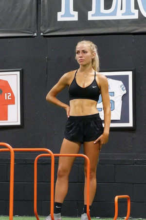 Fit blonde college athlete in soccer clothes