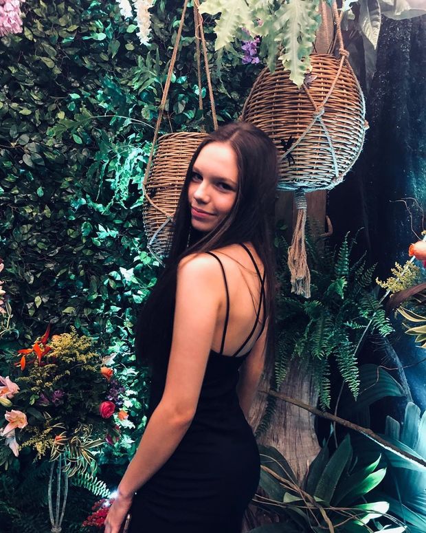 teen in black dress