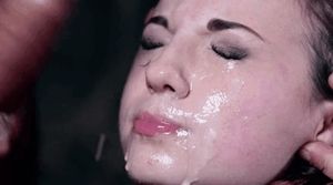 A tightly closed mouth avoids semen while being slapped with a penis.