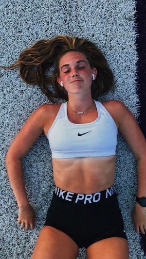 Fit athlete on field in Nike
