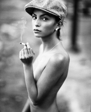 unknown model in flat cap credit to the photograph.