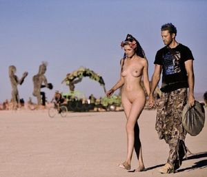 Showing her off nude at Burning Man.