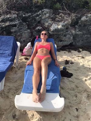 Bellas mom bikini laying down