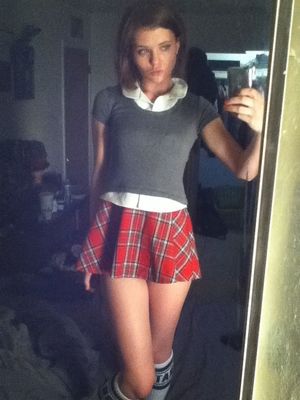 Brunette in a plaid skirt
