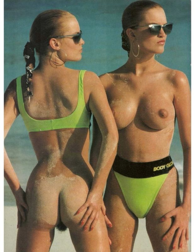 Two babes sharing a green bikini