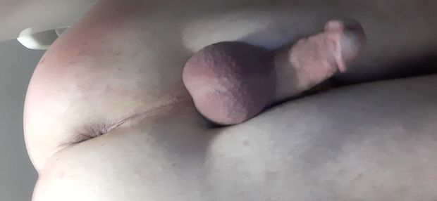Bent over amd cock between legs from behind
