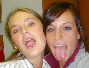 two babes tongues out