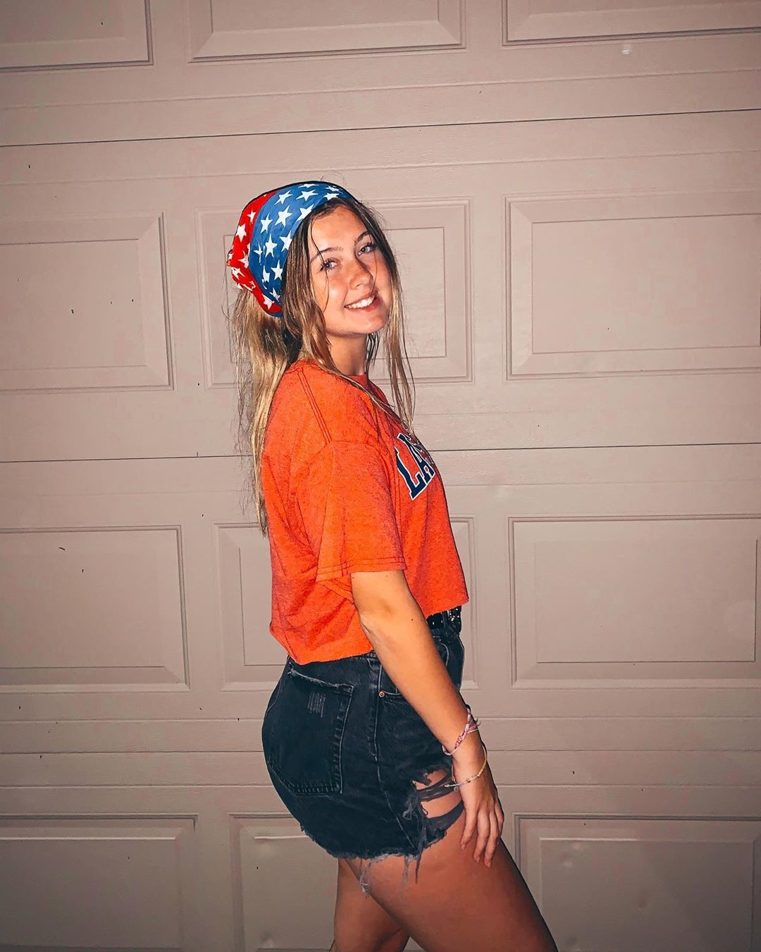 posing in front of the garage door