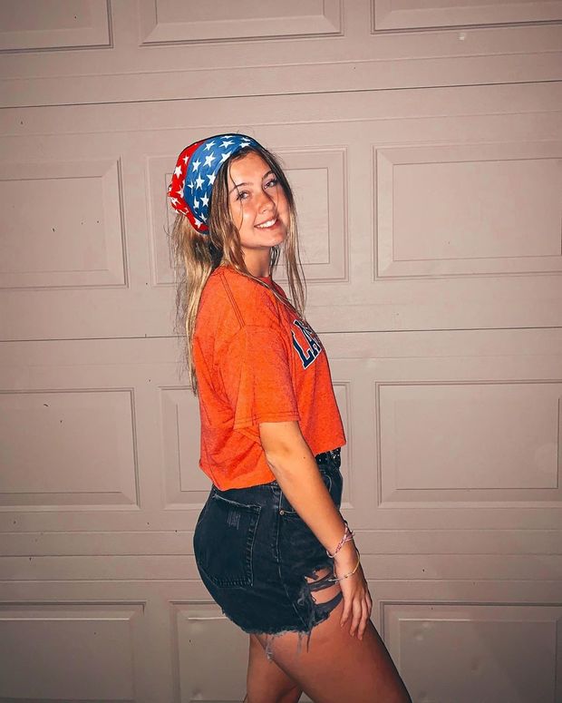 posing in front of the garage door