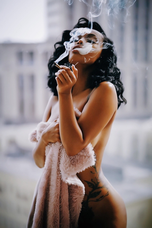 Selamawit Shiferaw smoking a blunt