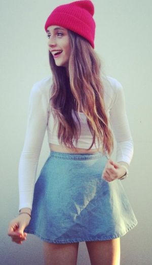 cute petite teen in a beanie and skirt