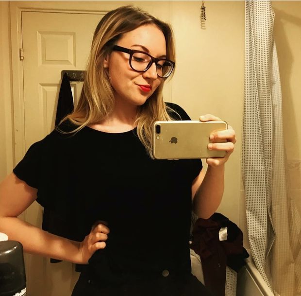 cute teen with glasses mirror selfie