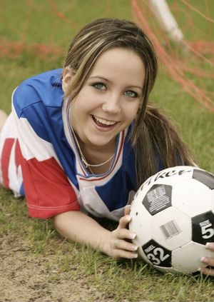 Cute brunette playing goalie