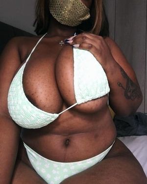 Milkshake Samme wearing a Green bikini