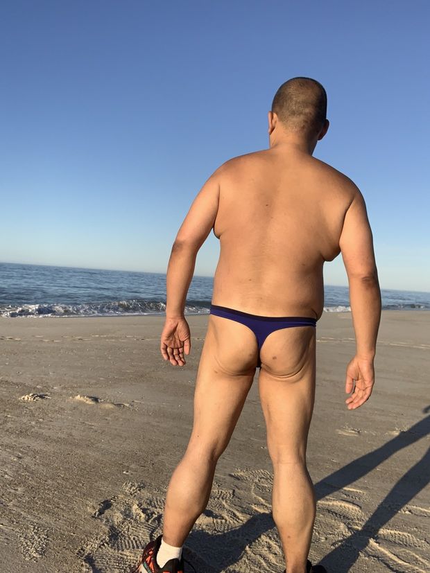 At the beach, in Cherry Grove, wearing my blue Calvin Klein thong