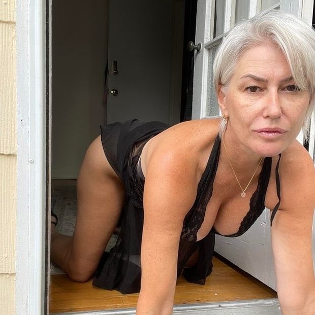 Submissive mature woman on all fours.