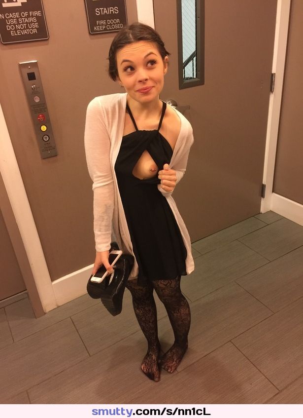Petite, well dressed cutie showing you her piercing.