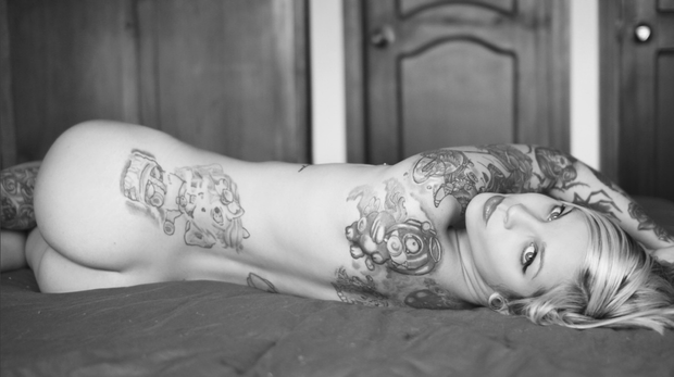 Inked beauty sprawled out