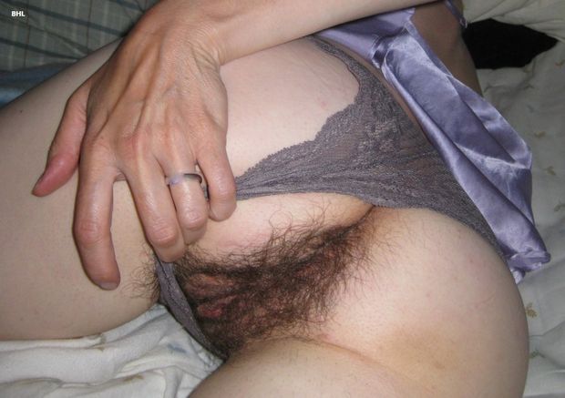 Spreading her hairy ass