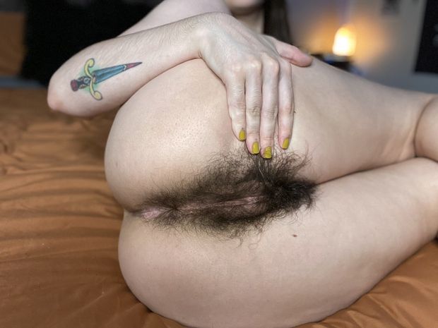 Spreading her hairy ass