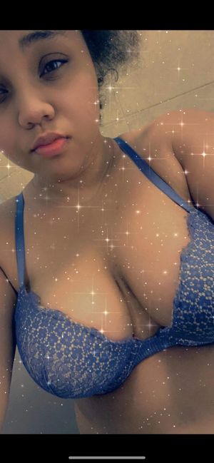 Mixed babe shows off her tits