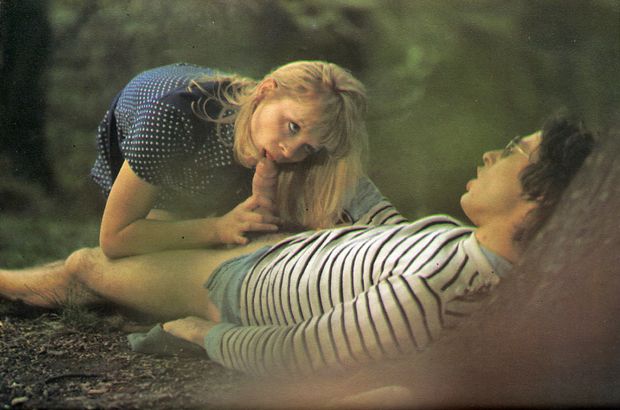 vintage photo of a blonde kissing and stroking a penis