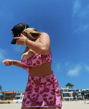 Millie gets her big tits out at the beach