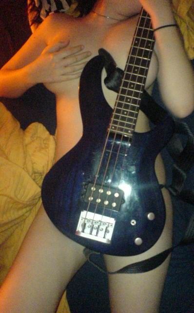teen posing on bed