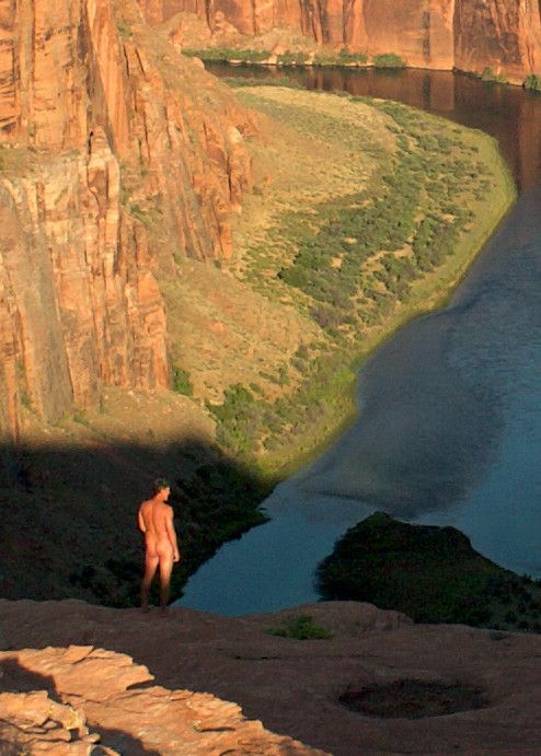 nude male outdoors enjoying canyon view