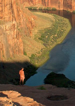 nude male outdoors enjoying canyon view