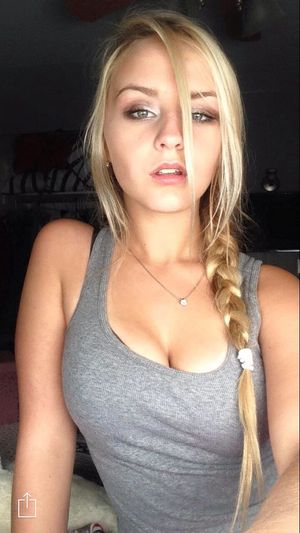 Cute blonde straining a tanktop